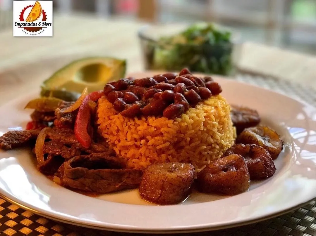 A plate of food with rice and beans on it.