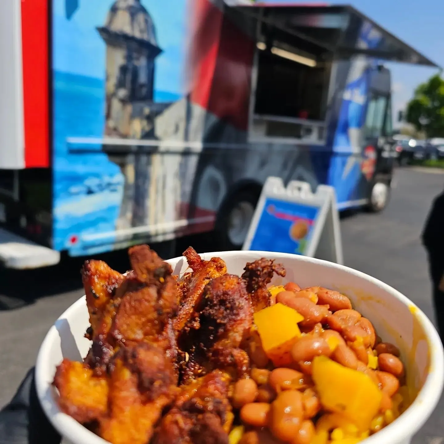 A bowl of food on the side of the road.